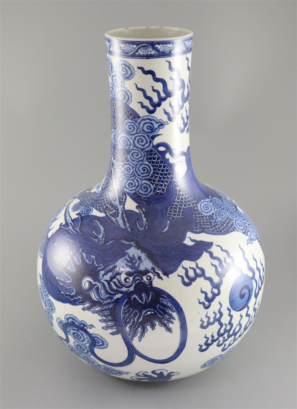 A large Chinese dragon bottle vase, Qianlong seal mark, probably late 19th century, 47cm high, wood stand